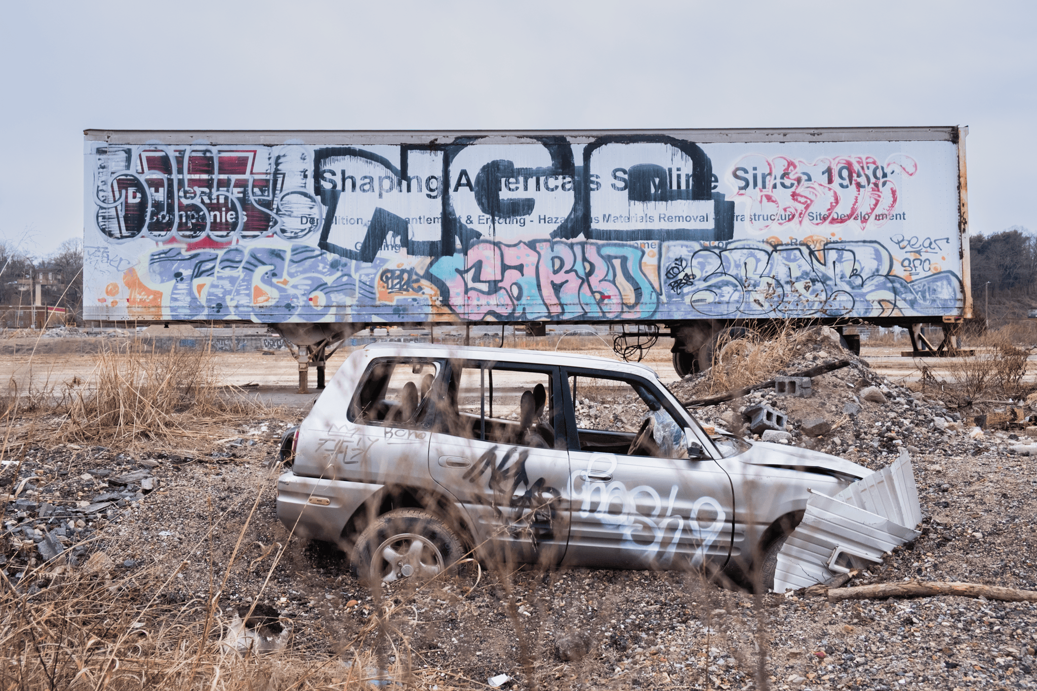 Car buried in debris in River Arts District