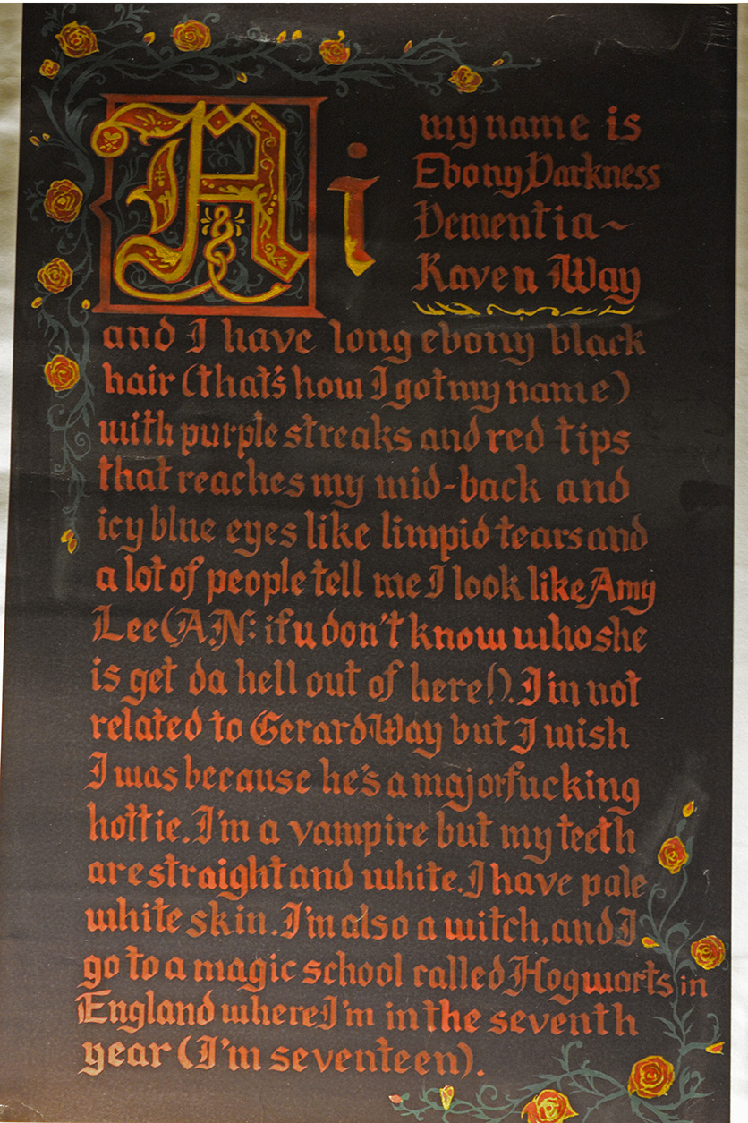 A black poster with red, oldstyle text hangs on a white wall. The text on the poster is the first quote of this article.